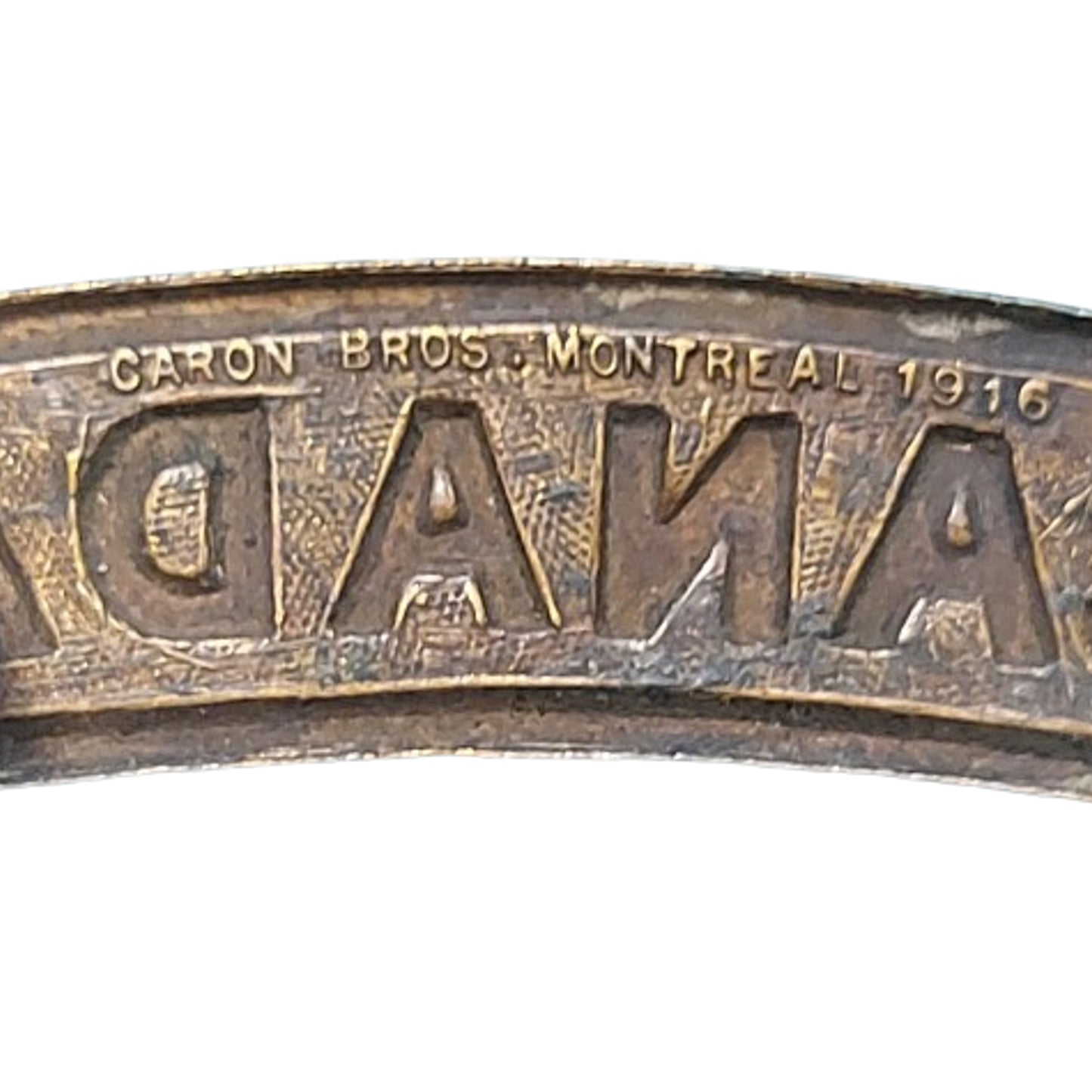 WW1 Canadian CANADA Brass Shoulder Title Caron Bros. 1916